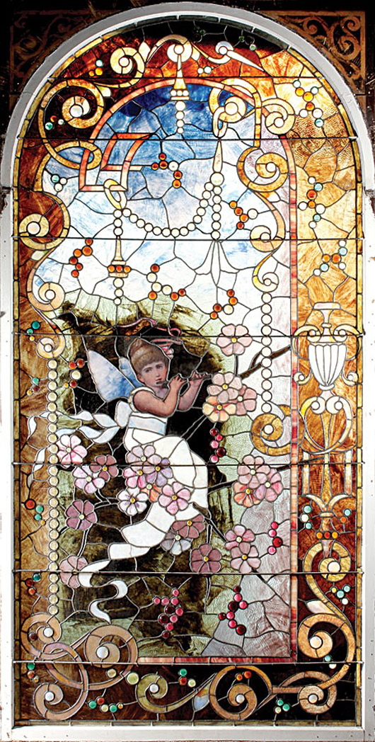 Massive American Aesthetic Movement stained glass window, circa 1890. Estimate: $18,000-$22,000. Image courtesy of Michaan’s Auctions.   