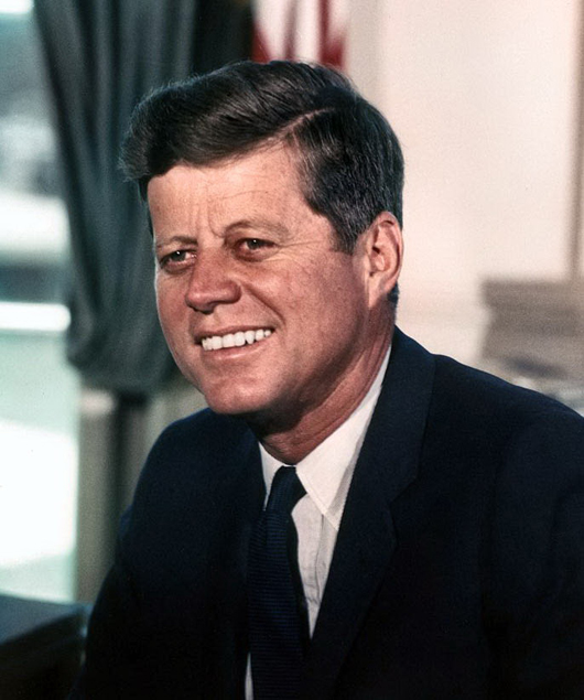 President John F. Kennedy in the Oval Office, July 1963. Image by Cecil Stoughton, courtesy of Wikimedia Commons.