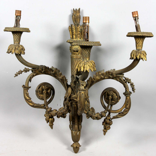 French 19th-century Louis XVI wall sconce, gilt bronze, 31 inches high x 26 1/2 inches wide x 16 inches deep. Estimate: $750-$1,250. Image courtesy of Kaminski Auctions.