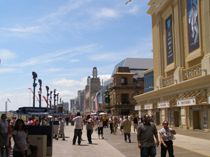 The Atlantic City Boardwalk, looking south. In the background is historic Boardwalk Hall, where The Beatles held one of their largest concerts on their first U.S. tour. This file is licensed under the Creative Commons Attribution 2.0 Generic license.