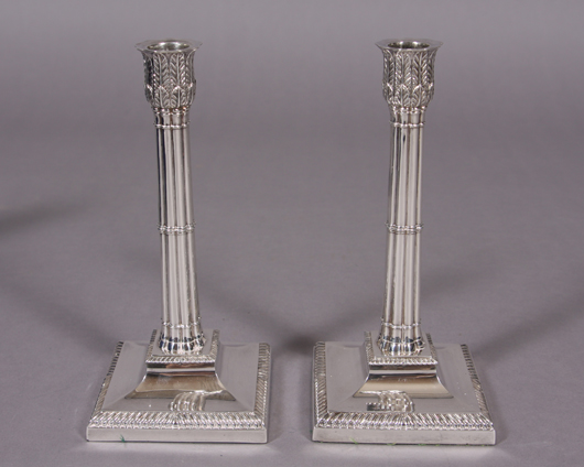 Victorian silver candlesticks. London, 1884, by Martin, Hall & Co. The candle socket of molded leaves above reeded standard on weighted square base, 9 inches. Estimate: $1,500-$1,200. Stefek’s Auctioneers & Appraisers.