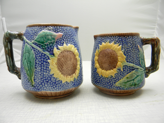 Cobalt Sunflower majolica pitchers. Image courtesy of Wilson's Auctioneers & Appraisers.