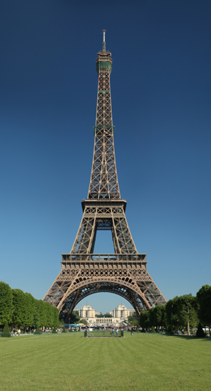 The Eiffel Tower, as seen from the Champ de Mars, was built as the entrance arch to the 1889 World’s Fair. Image courtesy of Wikimedia Commons.