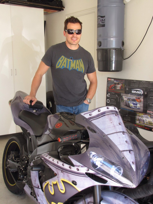 Antonio in the garage of his California home with one of two Batman-themed motorcycles.