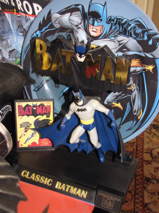 “Classic Batman” figure with colorful graphics and impressive backdrop display.