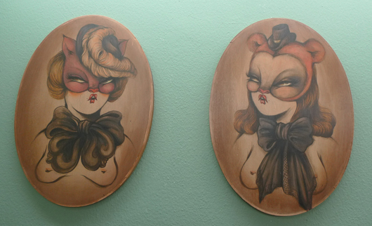 Two of Miss Van’s pouting women, on wood. Painting by Miss Van, photography courtesy of Inoperable Gallery.