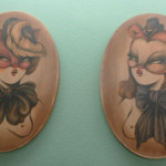 Two of Miss Van’s pouting women, on wood. Painting by Miss Van, photography courtesy of Inoperable Gallery.