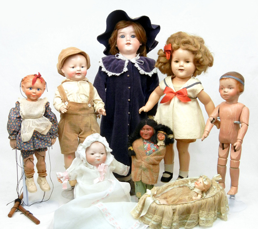 Selections from the approximately 75 lots of European and American dolls and group lots of doll clothing, dishes and reference books. Stephenson’s image.