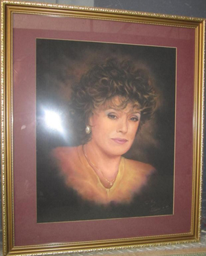 Portrait of Rue McClanahan by John Curran, pastel on paper, inscribed ‘To Rue’ signed John Curran lower right, matted and framed, 31 x 26 1/2 inches, together with documents and a photograph of McClanahan with artist. Estimate: $1,000-$1,500. Image courtesy of Hutter Auction Galleries.
