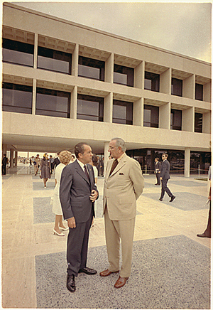 U.S. President Richard Nixon (left) standing with former president Lyndon Johnson outside the LBJ Library in Austin, Texas, in June 1971. Image courtesy of Wikimedia Commons.