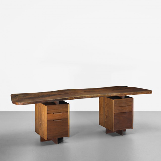 George Nakashima important double pedestal desk, USA, 1967,  American black walnut, 96 1/2 inches wide x 27 inches deep x 29 1/2 inches high, highly figured single-slab top, acquired directly from the artist. Estimate: $30,000-$50,000. Image courtesy of Wright.   