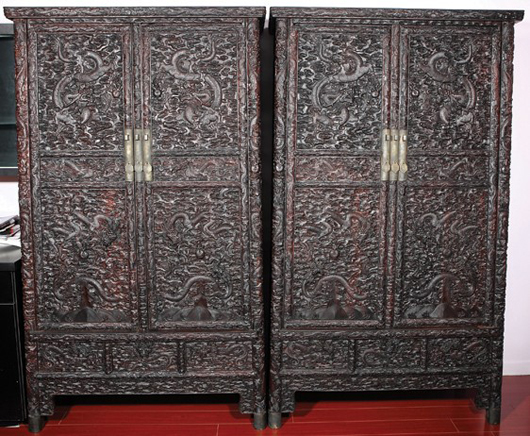 Zitan cabinets, carved cloud, dragon and sea, 74 1/4 inches high x 38 1/2 in wide. Estimate: $80,000-$120,000 for the pair. Image courtesy of Golden State Auction Gallery Inc.