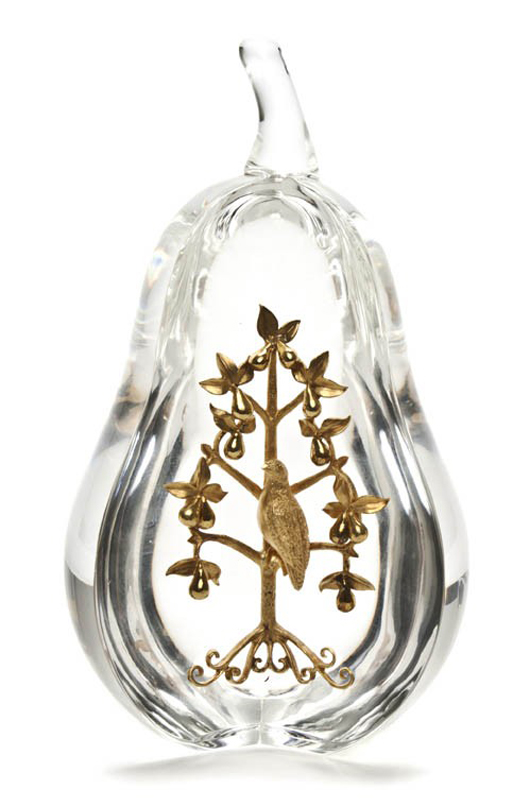 Steuben glass and 18K gold Partridge in a Pear Tree, modern, in the form of a pear and inset with a gold partridge in a tree, engraved 'Steuben,' 6 1/2 inches high, with original fitted case. Estimate: $1,500-$2,500. Image courtesy of Leslie Hindman Auctioneers.
