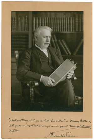 Photo of Thomas Edison holding his 1910 invention, the alkaline storage battery. The autographed photo sold at RR Auction for $32,310. Image appears with permission of RR Auction.