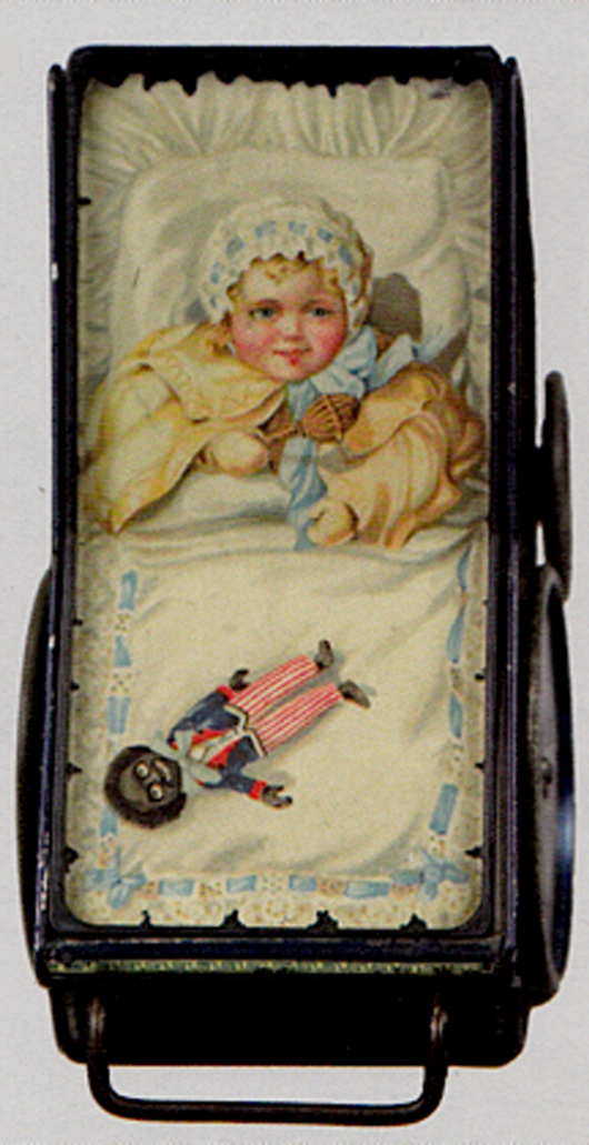 Baby pram biscuit tin with lithographed baby and golliwog, $6,325. Bertoia Auctions image.
