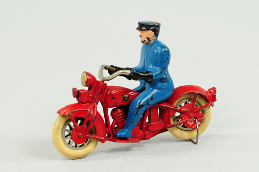 Kilgore cast-iron motorcycle with policeman driver, $4,888. Bertoia Auctions image.