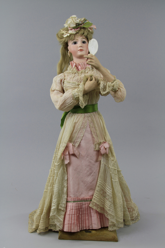 Vichy automaton of lady with hand mirror, 30 inches tall, Jumeau head, $18,400. Bertoia Auctions image.