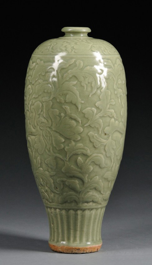 Ming period 17-inch celadon vase with relief floral scrolling. Realized: $18,960. Image courtesy of LiveAuctioneers.com Archive and Skinner Inc.
