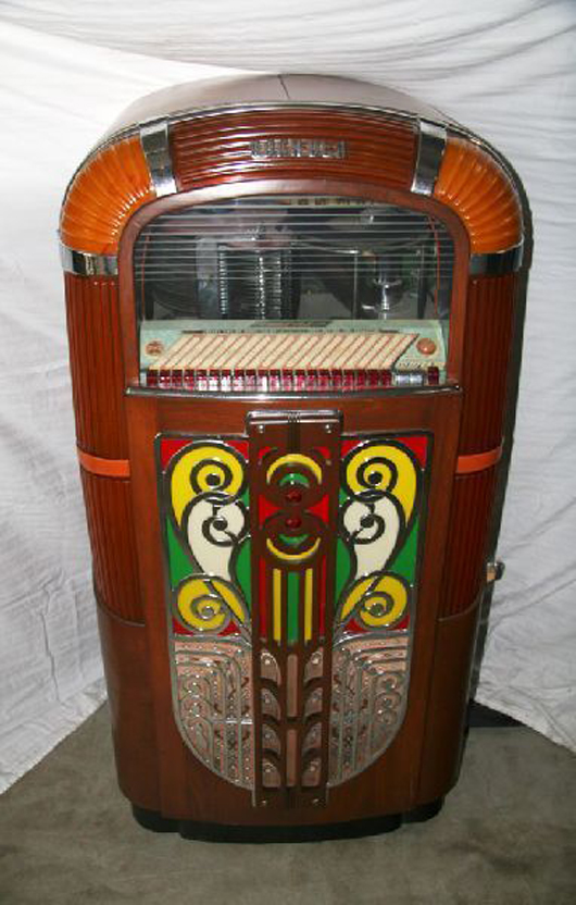 1940s Rock-Ola jukebox with illuminating Art Deco façade, est. $5,100-$10,200. Government Auction image.   