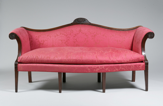 Diminutive Federal mahogany upholstered settee, carving attributed to Samuel McIntire (1751-1811), Salem, Mass., circa 1800-1811. Est. $40,000-$80,000. Image courtesy of Keno Auctions.