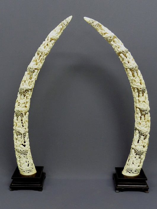 Massive pair of Chinese carved ivory elephant tusks with 20 human figures in each tusk, 46 inches overall, great condition. Estimate: $5,000-$10,000. Image courtesy of Jay Anderson Antique Auction.