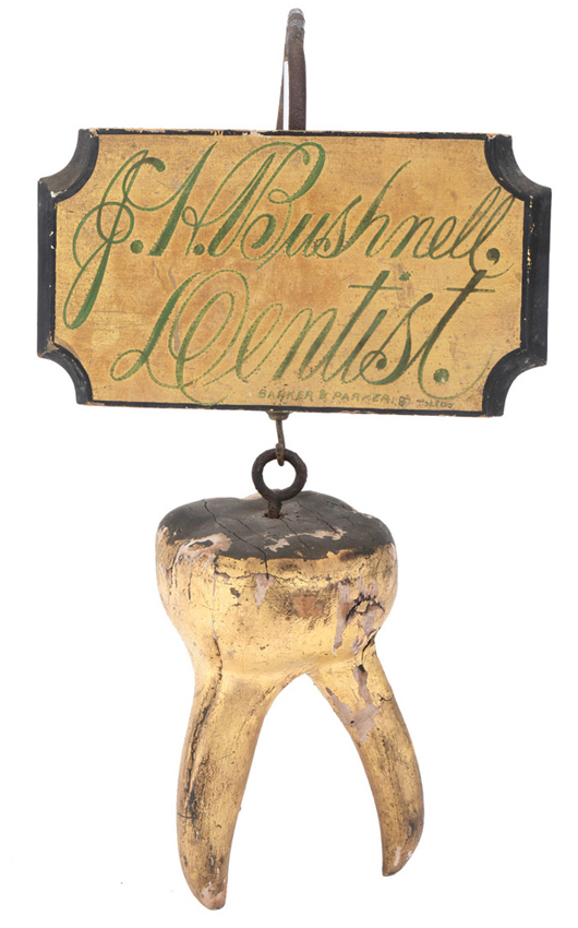 Painted-wood trade sign for J. H. Bushnell, Dentist, featuring a mammoth figural “tooth,” $10,350. Noel Barrett Auctions image.