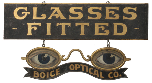 “Glasses Fitted” optician trade with a suspended pair of oversize spectacles, $12,650. Noel Barrett Auctions image.