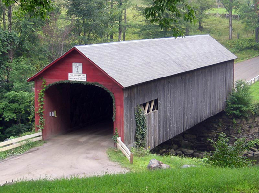Covered bridge in Guilford, Vt., with now-missing sign that warns of 'Two dollars fine to drive on this bridge faster than a walk.' Aug. 20, 2004 photo by Jared C. Benedict, licensed under the Creative Commons Attribution-Share Alike 3.0 Unported license.