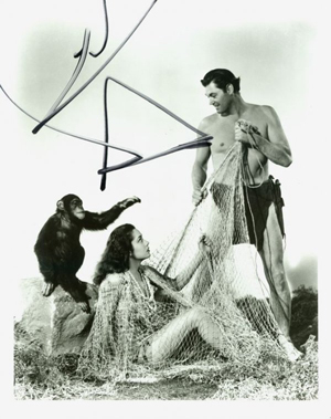 Cheetah, Tarzan's chimp, 'autographed' this photograph, which also pictures Johnny Wiessmuller and Maureen O'Hara. Image courtesy of LiveAuctioneers Archive and Signature House.