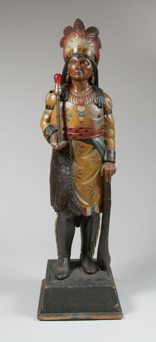 Carved and painted Indian 'totem' figure from the Red Men's Lodge. Headdress painted 'TOTEM.' Axe blade marked 'I.O.R.M.' (Improved Order of Redman). Est. $10,000-$20,000. Image courtesy of Keno Auctions.