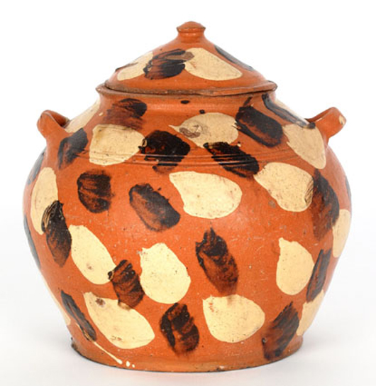 This earthenware sugar bowl is a rare Alamance County, N.C., piece, originally bought by Titus Geesey from Joe Kindig Jr. in 1930. Estimate: $10,000-$20,000. Image courtesy of Pook & Pook Inc. 