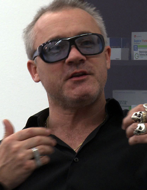 English artist Damien Hirst in a still image from the 2010 documentary 'The Future of Art' by Erik Niedling and Ingo Niermann. Image supplied by Christian Gomer, licensed under the Creative Commons Attribution-Share Alike 3.0 Unported license.