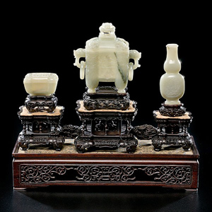 Finely carved and rare pale celadon jade altar set. Estimate: $20,000-$30,000. Image courtesy of Cowan's Auctions Inc.