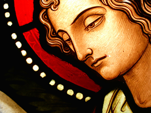 Detail from a 19th- or 20th-century window in Eyneburg, Belgium, showing detailed polychrome painting of a face. Image by Lusitana. This file is licensed under the Creative Commons Attribution-Share Alike 3.0 Unported license.