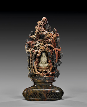 Chinese carved soapstone grotto centering Guanyin on lotus base with two attendants, circa 1900, 15 3/8 inches high. Estimate: $800-$1,200. Image courtesy I.M. Chait Gallery Auctioneers.