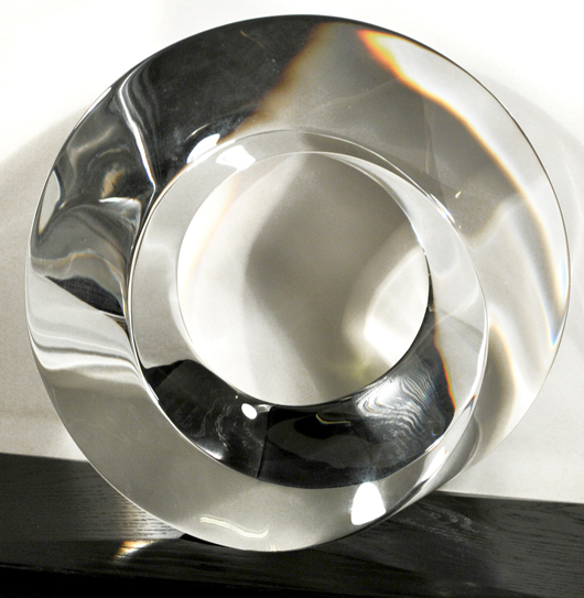 Steuben Mobius Prism glass sculpture by Peter Drobny, signed, designed by Drobny in 1993, 11 3/4 inches high. Estimate $ 5,000-$6,000. Image courtesy of Gray’s Auctioneers.   
