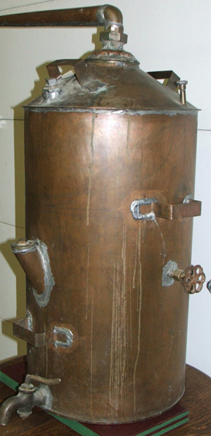 This copper moonshine still sold for $400 at an auction in Colorado in 2007. Image courtesy of LiveAuctioneers.com Archive and Bean & Bean Auctions Inc.