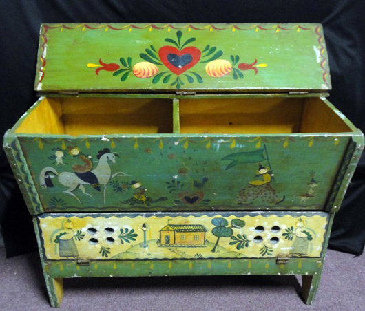 Pennsylvania polychrome painted folk art storage chest with perforated bottom drop drawer. Image courtesy of Specialists of the South.