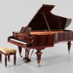 Brunk Auctions in Asheville, N.C., sold this early 1900s Bosendorfer grand piano on Jan. 14 for $52,800. It featured a figured mahogany case. Image courtesy of LiveAuctioneers.com Archive and Brunk Auctions.
