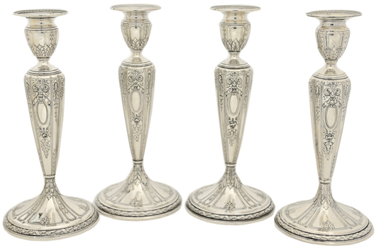 A set of four Gorham sterling silver candlesticks, early 20th century, monogrammed 'FCP' in an oval cartouche for Frederick C. Proctor, estimate: $3,500-$6,500. Image courtesy of Morton Kuehnert Auctioneers & Appraisers.