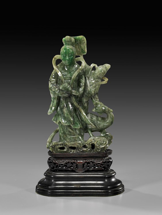 Antique Chinese carved and openwork, green jadeite figure of an Immortal beauty with an attendant and crane beside her, 10 3/4 inches high. Estimate: $20,000-$25,000. Image courtesy of I.M. Chait.