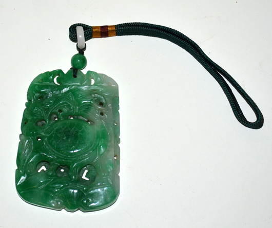This statement-making antique Chinese jade pendant (lot 448) is a beautiful work of art. Image courtesy of Roland Auction.