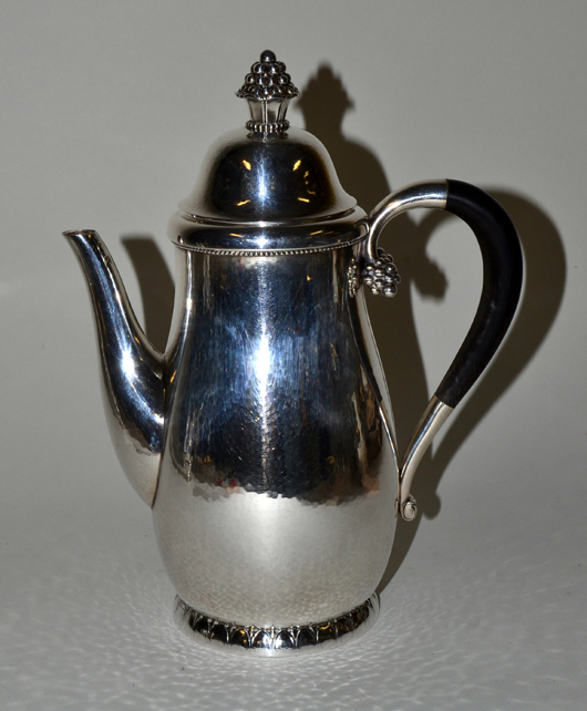 Pour your special someone morning coffee from this beautiful Georg Jensen sterling silver coffeepot (lot 509). Image courtesy of Roland Auction.