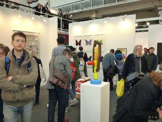 Visitors flock to the stand of Damien Hirst's gallery 'Other Criteria' at the London Art Fair in Islington in January, but most dealers reported slow trade compared to previous years. Image: Auction Central News.