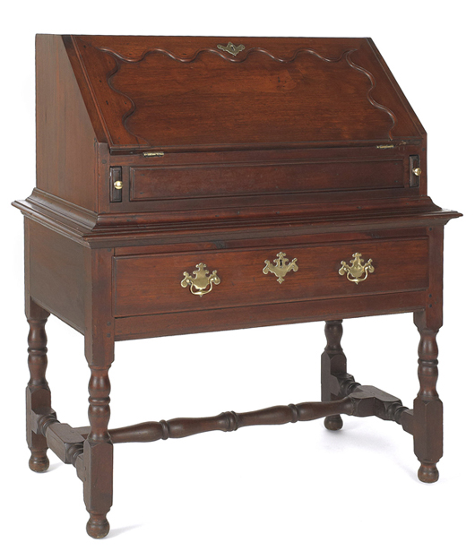 This Chester County walnut desk on frame attracted a lot of interest. Dating to circa 1745, this is an early and unusual form. It easily surpassed the high estimate of $8,000 to sell for $30,810. Image by Pook & Pook Inc.