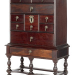 This Philadelphia William and Mary mahogany spice or valuables box on frame has a large center drawer that conceals a secret drawer. The important cabinet sold for $112,575. Image by Pook & Pook Inc.
