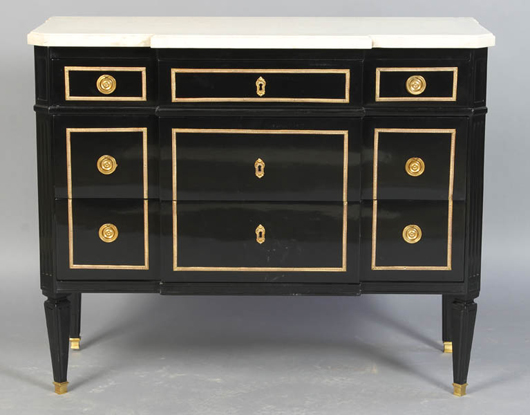 Directoire-style ebonized commode having a shaped marble top over three bronze mounted block front drawers flanked by columns, circa 1940. Estimate: $1,500-$2,500. Image courtesy of Kamelot Auction House.
