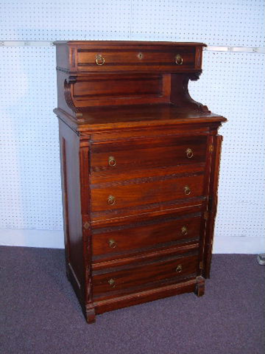 This Eastlake style chest, circa 1880, should have teardrop pulls instead of English Regency ring pulls. Photos courtesy of Turkey Creek Auction, Citra, Fla.