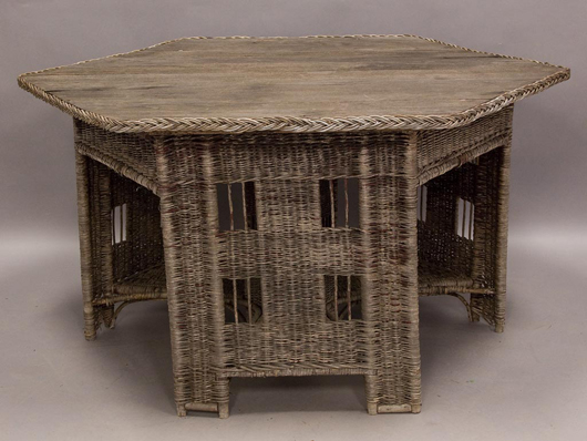 Rare Gustav Stickley Arts & Crafts willow/wicker dining table with center pedestal and ‘prison window’ cutouts, 48-inch hexagon top. Estimate: $500-$800. Image courtesy Jeffrey S. Evans & Associates. 
