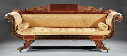Among the lots of Classical furniture, a Baltimore sofa in Pompeian red with gilt decoration, 1815-1825, went to a bidder on the auction floor for $11,950. Image courtesy Neal Auction Co.